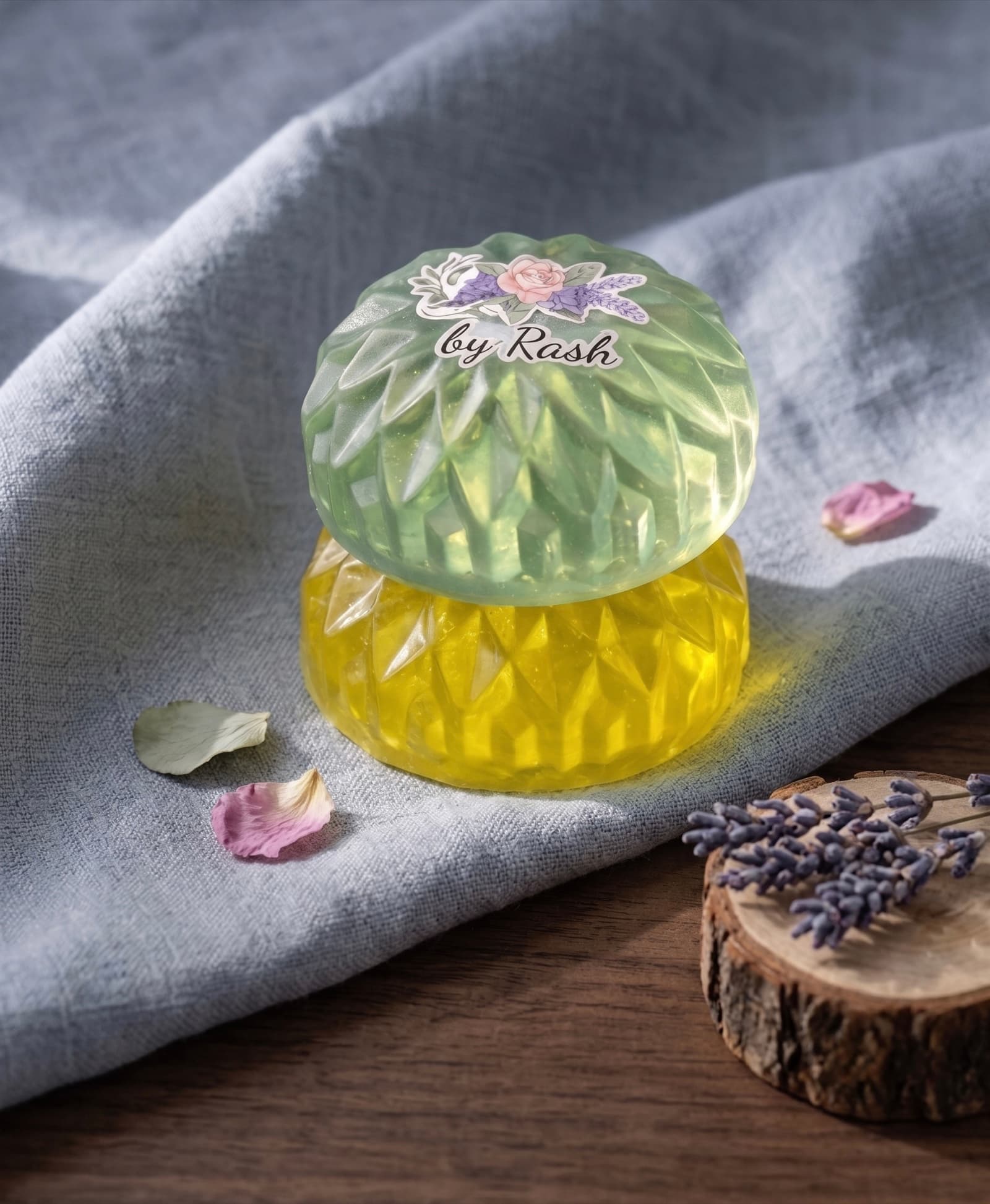 Two handmade Florush soaps with a 'by Rash' label, surrounded by petals and lavender